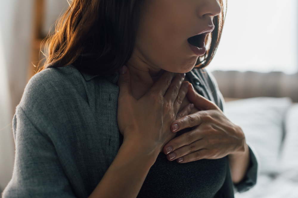 woman gasping for air with open mouth